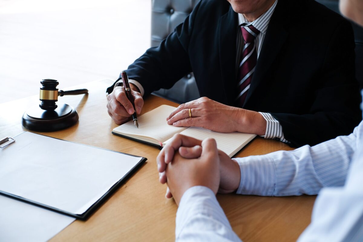 Legal arbitration proceedings with gavel and documents