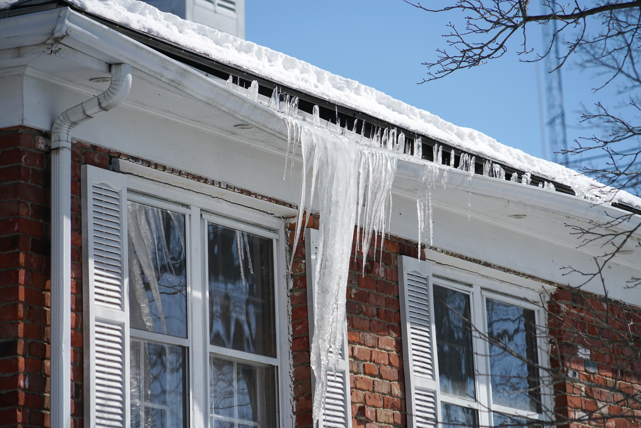 Ice dams on rooftop after solar panel installation
